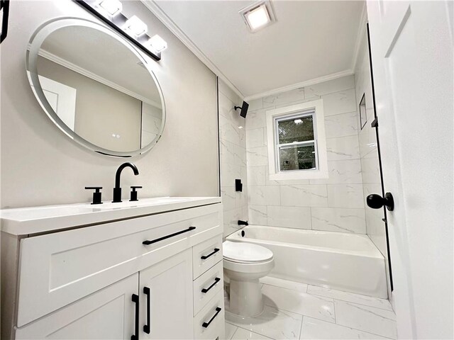 full bathroom with ornamental molding, vanity, tiled shower / bath, and toilet