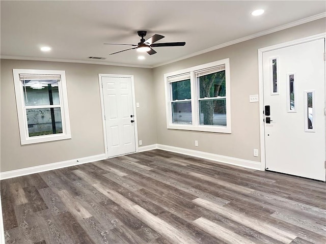 foyer entrance featuring ceiling fan, dark hardwood / wood-style floors, and ornamental molding