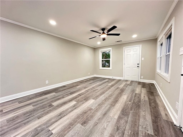 spare room featuring ceiling fan, hardwood / wood-style flooring, and ornamental molding