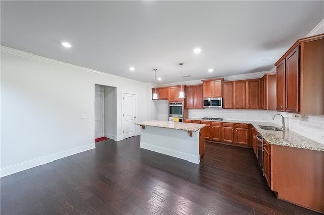 5789 Creek Indian Dr, Sugar Hill, GA 30518 - kitchen with appliances with stainless steel finishes, a sink, brown cabinets, baseboards, and tasteful backsplash