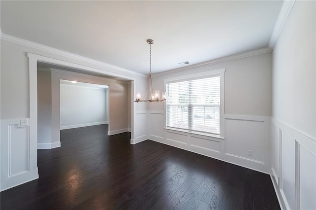 5789 Creek Indian Dr, Sugar Hill, GA 30518 - unfurnished dining area with a chandelier, dark wood-type flooring, wainscoting, ornamental molding, and a decorative wall