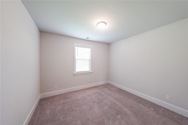 5789 Creek Indian Dr, Sugar Hill, GA 30518 - carpeted spare room featuring baseboards