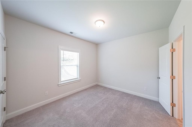 5789 Creek Indian Dr, Sugar Hill, GA 30518 - unfurnished bedroom with light colored carpet and baseboards