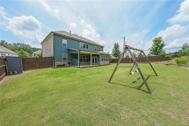 5789 Creek Indian Dr, Sugar Hill, GA 30518 - rear view of house with a playground and a patio area
