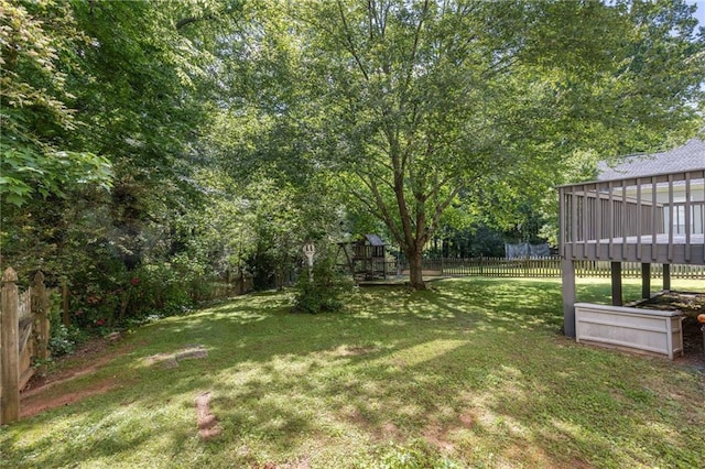 view of yard featuring a wooden deck