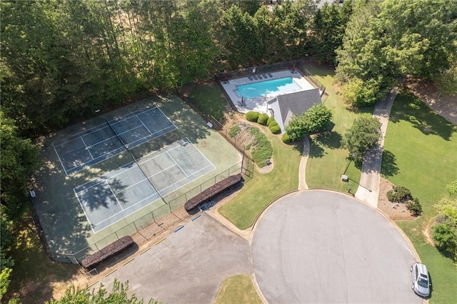 view of property location with a pool