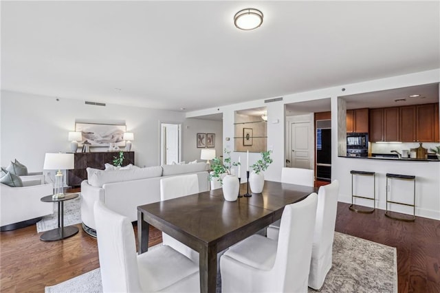 dining room featuring dark hardwood / wood-style flooring