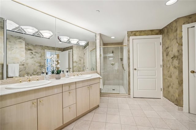 bathroom featuring tile patterned flooring, vanity, and a shower with door