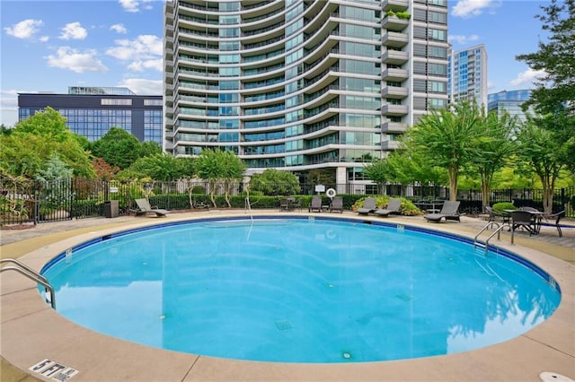 view of swimming pool with a patio area