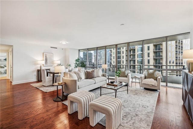 living room featuring dark hardwood / wood-style floors and floor to ceiling windows