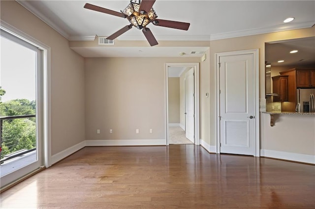 unfurnished living room featuring crown molding, ceiling fan, light wood finished floors, baseboards, and recessed lighting