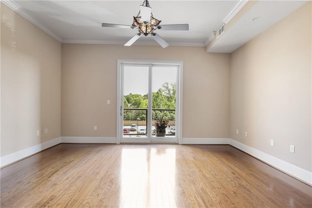 unfurnished room with a ceiling fan, light wood-type flooring, ornamental molding, and baseboards