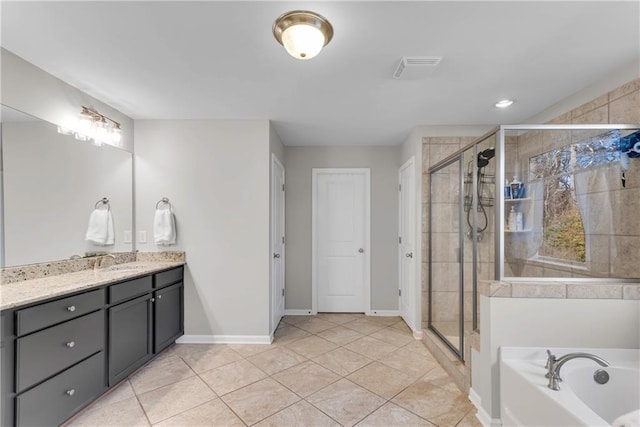 bathroom featuring separate shower and tub, tile patterned flooring, and vanity