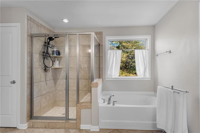 bathroom with separate shower and tub