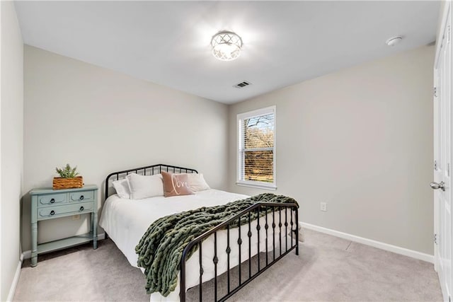 bedroom featuring light carpet