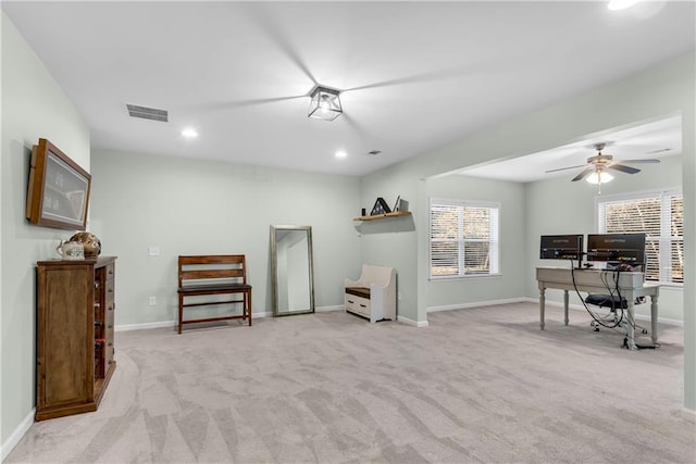 interior space with light colored carpet and ceiling fan