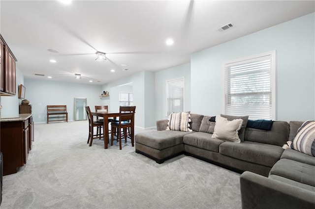 living room with light colored carpet