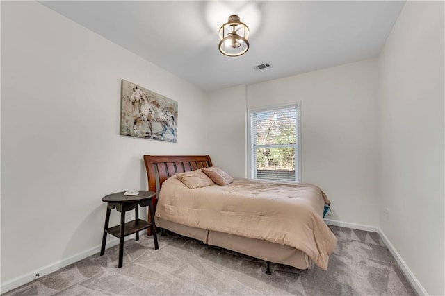 bedroom with light carpet