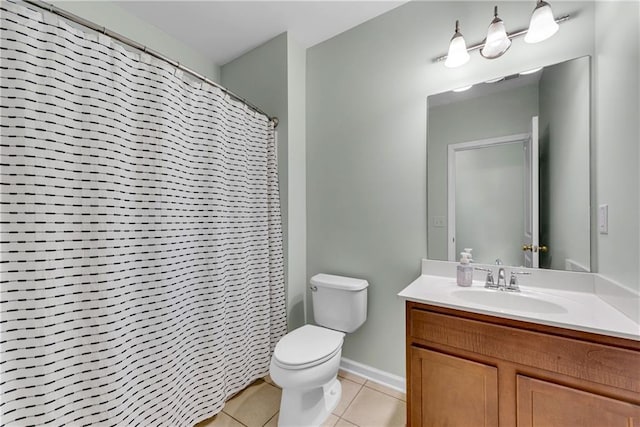 bathroom with toilet, tile patterned flooring, vanity, and curtained shower