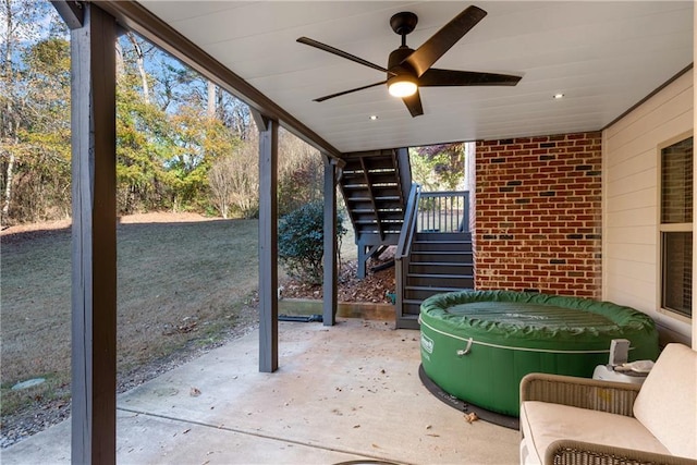 view of patio / terrace featuring ceiling fan