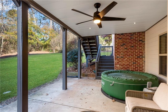 view of patio featuring ceiling fan