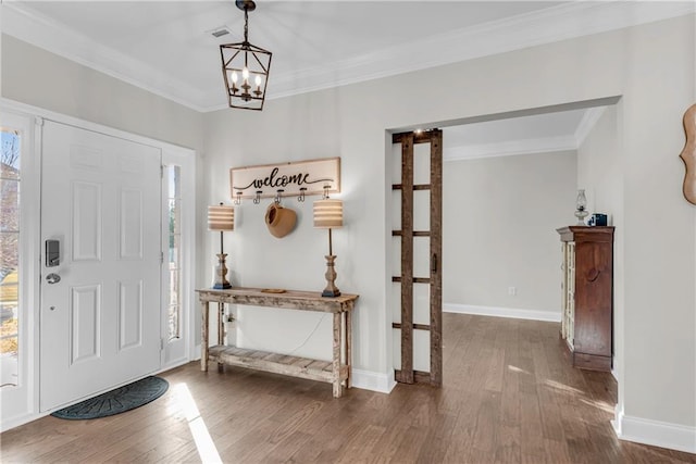 entryway featuring a wealth of natural light, a notable chandelier, and dark hardwood / wood-style flooring