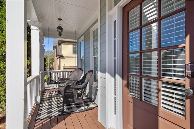 wooden terrace featuring a porch