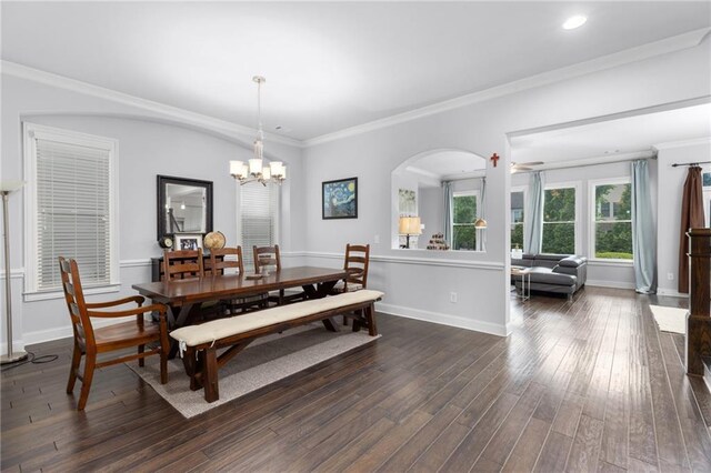 3380 Labrouste Cv, Duluth, GA 30097 - dining space with crown molding, baseboards, dark wood-style floors, and a chandelier