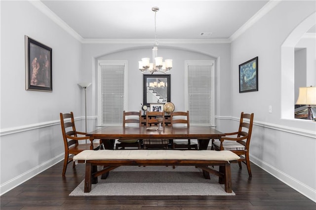 3380 Labrouste Cv, Duluth, GA 30097 - dining room with crown molding, arched walkways, a notable chandelier, and wood finished floors