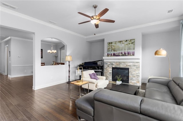 3380 Labrouste Cv, Duluth, GA 30097 - living room with arched walkways, ceiling fan with notable chandelier, baseboards, wood finished floors, and visible vents
