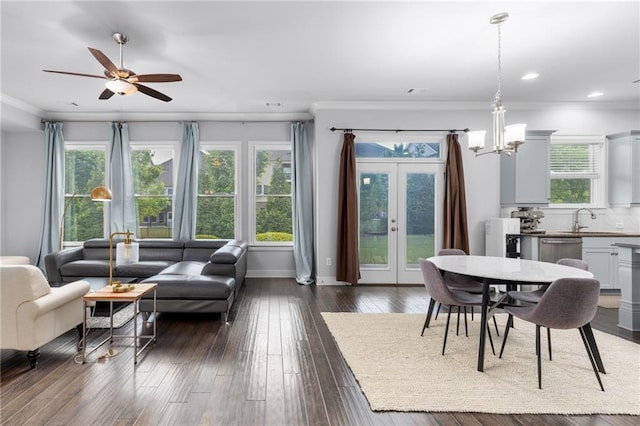 3380 Labrouste Cv, Duluth, GA 30097 - interior space featuring ornamental molding, baseboards, dark wood-style floors, french doors, and ceiling fan with notable chandelier