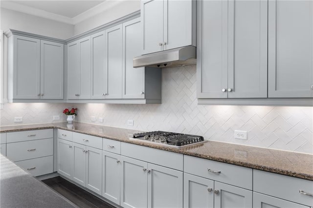 3380 Labrouste Cv, Duluth, GA 30097 - kitchen featuring crown molding, stone counters, decorative backsplash, stainless steel gas stovetop, and under cabinet range hood