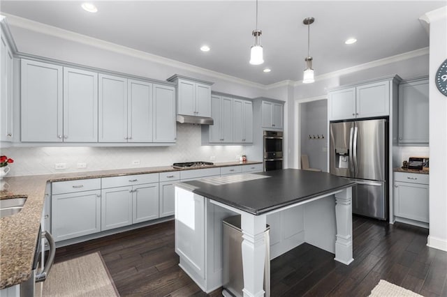 3380 Labrouste Cv, Duluth, GA 30097 - kitchen featuring dark wood finished floors, stainless steel appliances, decorative backsplash, under cabinet range hood, and ornamental molding