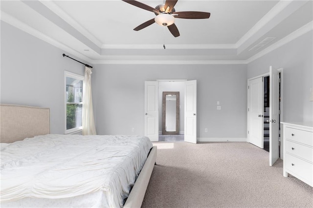 3380 Labrouste Cv, Duluth, GA 30097 - bedroom with ornamental molding, a ceiling fan, a tray ceiling, and light colored carpet