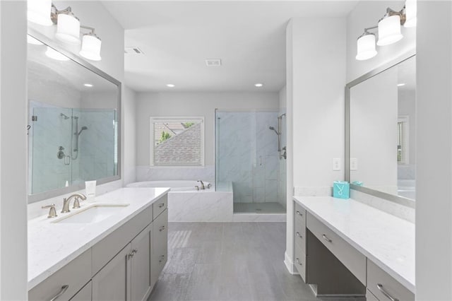 3380 Labrouste Cv, Duluth, GA 30097 - bathroom with vanity, a marble finish shower, recessed lighting, visible vents, and a garden tub