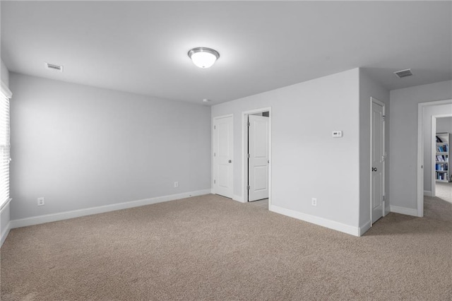 3380 Labrouste Cv, Duluth, GA 30097 - unfurnished bedroom featuring baseboards, multiple windows, carpet, and visible vents