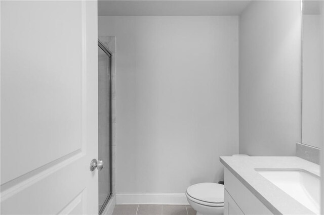 3380 Labrouste Cv, Duluth, GA 30097 - bathroom with tile patterned flooring, a shower stall, vanity, baseboards, and toilet