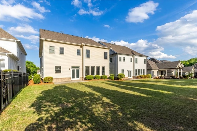 3380 Labrouste Cv, Duluth, GA 30097 - back of house with a yard, fence, a residential view, and french doors