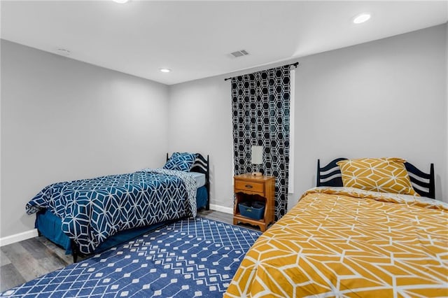 bedroom featuring dark hardwood / wood-style floors