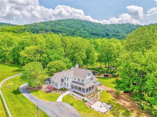 view from above of property with a forest