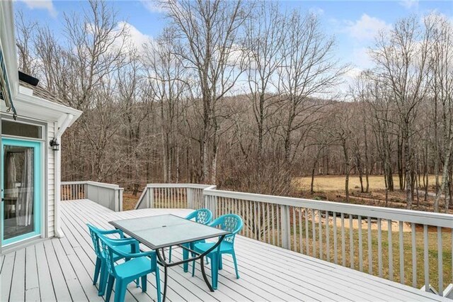 wooden deck featuring outdoor dining space