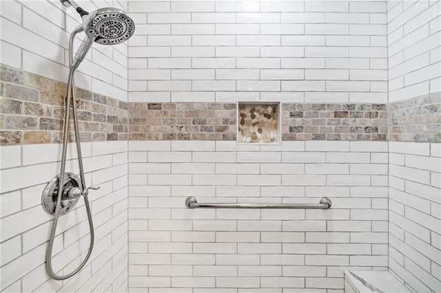 full bathroom with a tile shower