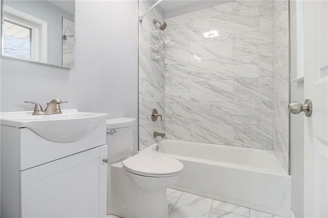 bathroom featuring toilet, marble finish floor, shower / tub combination, and vanity