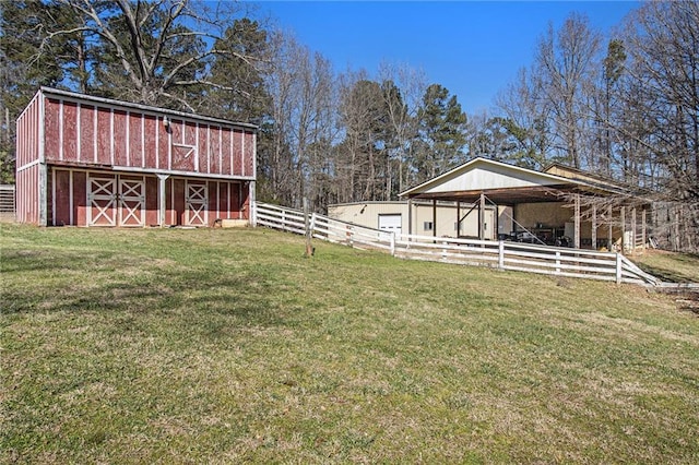 view of yard with an outbuilding and a barn