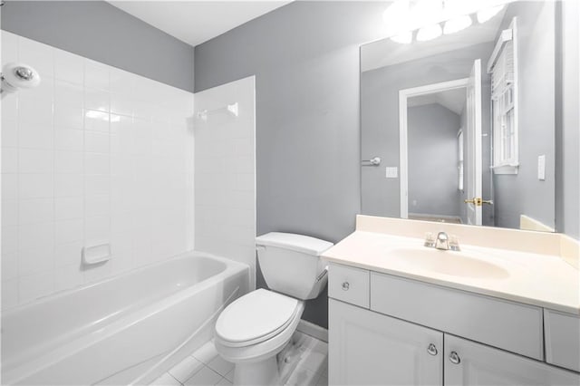 bathroom with washtub / shower combination, vanity, and toilet