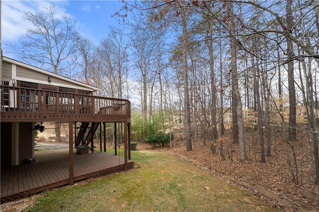 view of yard with stairway and a wooden deck