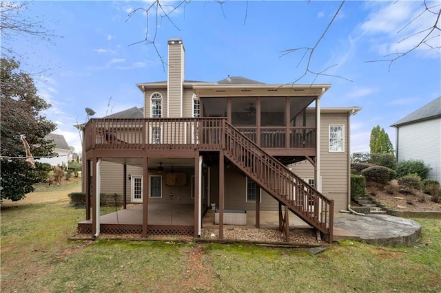 back of house with a patio, a sunroom, stairs, a deck, and a yard