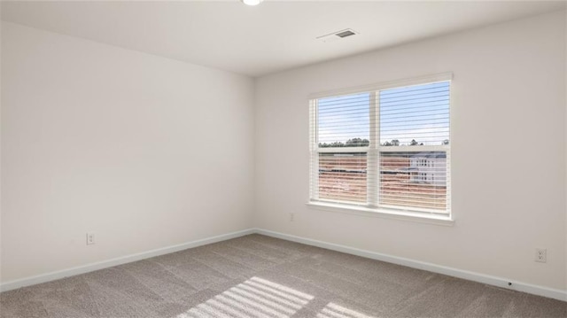 spare room featuring carpet