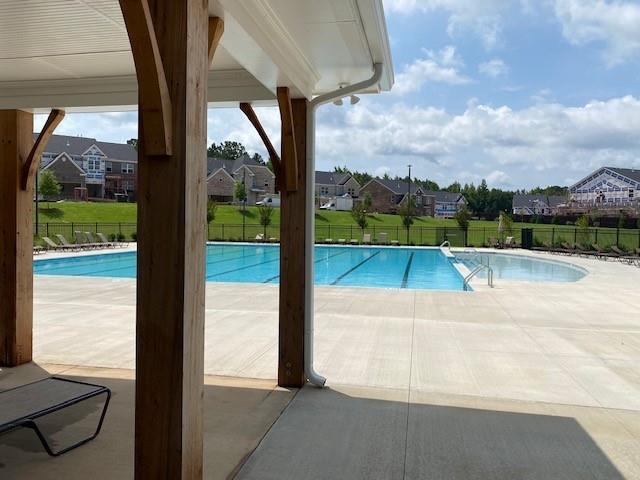 view of swimming pool featuring a patio area