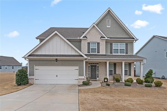 craftsman inspired home with roof with shingles, a porch, board and batten siding, a garage, and driveway